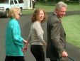 President Clinton, his daughter Chelsea, center, and wife Hillary Rodham Clinton walk from the White House toward a helicopter as they depart for vacation Tuesday, Aug. 18, 1998. The first family will travel to Martha's Vineyard, Mass. for a two week vacation. Late Monday night, the president confessed to a relationship with former White House intern Monica Lewinsky following an afternoon of testimony before the independent counsel's grand jury. (AP Photo/Roberto Borea)